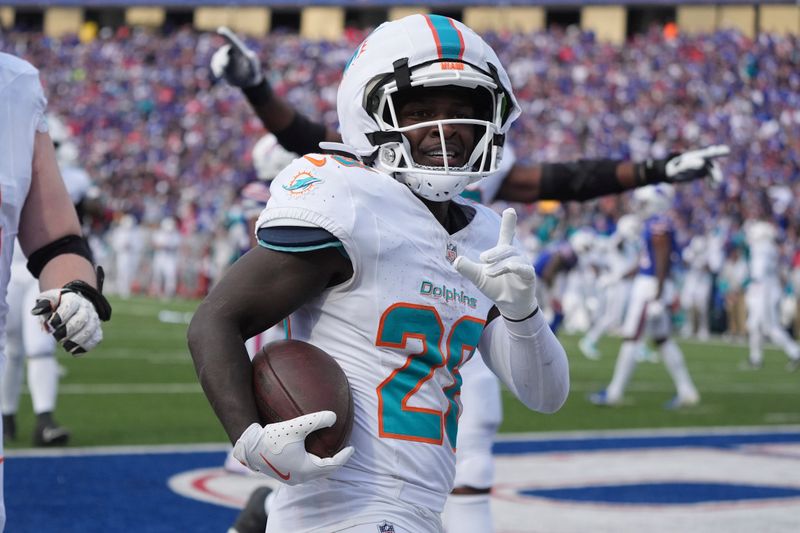 Miami Dolphins running back De'Von Achane celebrates his touchdown run during the second half of an NFL football game against the Buffalo Bills, Sunday, Nov. 3, 2024, in Orchard Park, N.Y. (AP Photo/Gene Puskar)