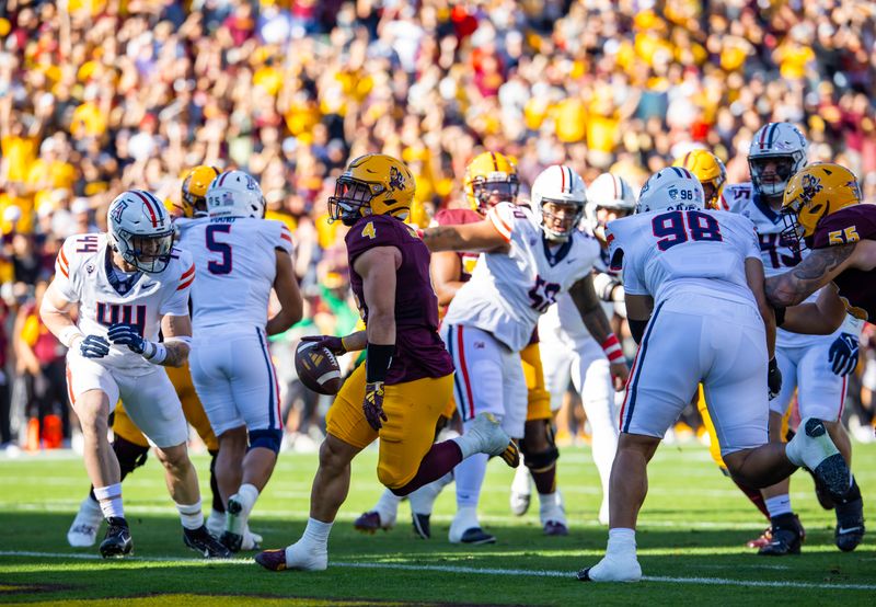 Nov 25, 2023; Tempe, Arizona, USA; Arizona State Sun Devils running back Cameron Skattebo (4) scores a touchdown against the Arizona Wildcats in the first half of the Territorial Cup at Mountain America Stadium. Mandatory Credit: Mark J. Rebilas-USA TODAY Sports