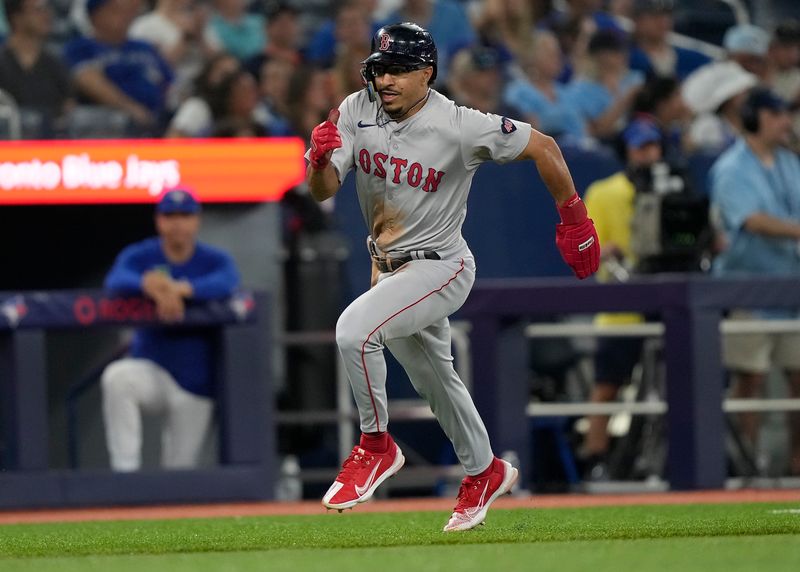 Jun 18, 2024; Toronto, Ontario, CAN; Boston Red Sox shortstop David Hamilton (70) scores on a single hit by shortstop Ceddanne Rafaela (not pictured)during the eighth inning against the Toronto Blue Jays at Rogers Centre. Mandatory Credit: John E. Sokolowski-USA TODAY Sports