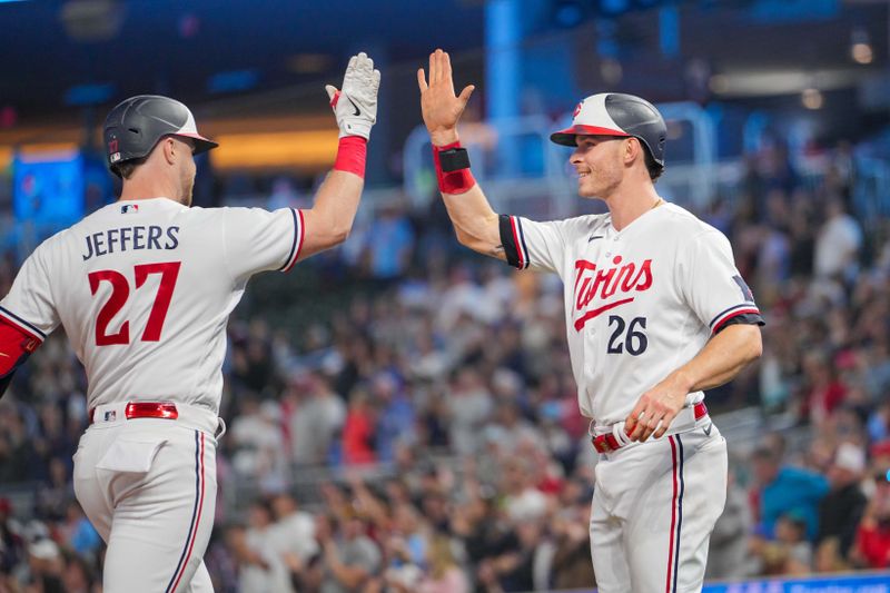 Sep 27, 2023; Minneapolis, Minnesota, USA; Minnesota Twins designated hitter Ryan Jeffers (27) celebrates his home run with right fielder Max Kepler (26) against the Oakland Athletics in the sixth inning at Target Field. Mandatory Credit: Brad Rempel-USA TODAY Sports