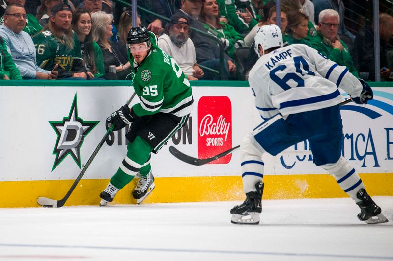 Oct 26, 2023; Dallas, Texas, USA; Dallas Stars center Matt Duchene (95) looks to move the puck past Toronto Maple Leafs center David Kampf (64) during the third period at the American Airlines Center. Mandatory Credit: Jerome Miron-USA TODAY Sports