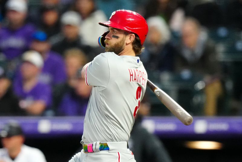 May 12, 2023; Denver, Colorado, USA; Philadelphia Phillies designated hitter Bryce Harper (3) doubles in the seventh inning against the Colorado Rockies at Coors Field. Mandatory Credit: Ron Chenoy-USA TODAY Sports