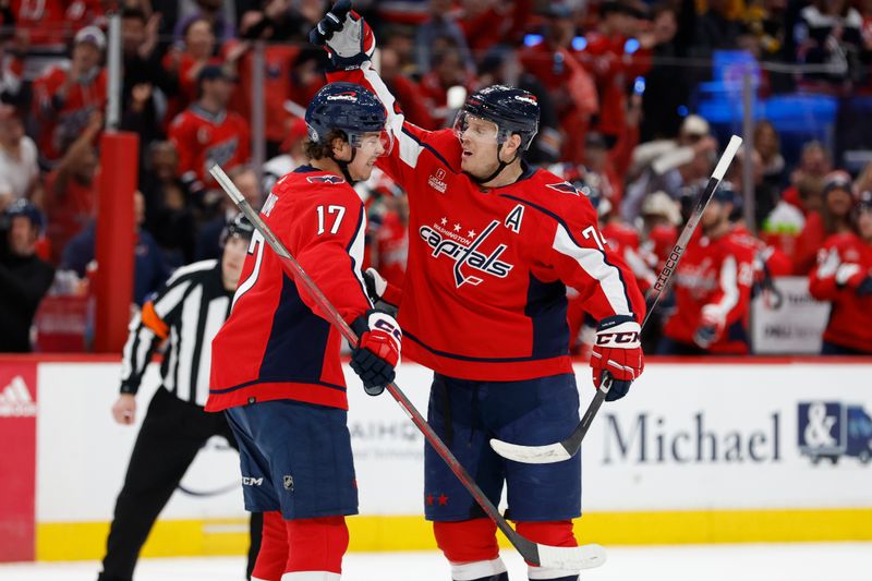 Apr 15, 2024; Washington, District of Columbia, USA; Washington Capitals defenseman John Carlson (74) celebrates with Capitals center Dylan Strome (17) after scoring a goal against the Boston Bruins in the first period at Capital One Arena. Mandatory Credit: Geoff Burke-USA TODAY Sports