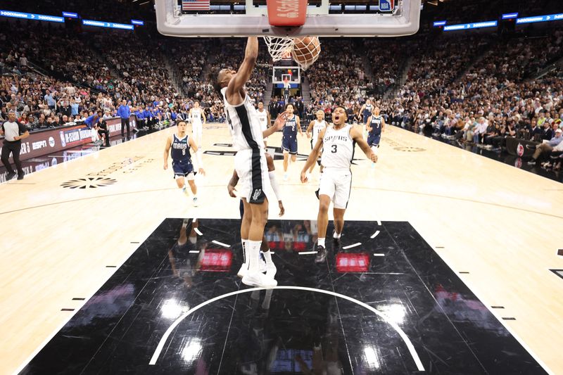 SAN ANTONIO, TEXAS - OCTOBER 25: Devin Vassell #24 of the San Antonio Spurs dunks during the second quarter against the Dallas Mavericks at Frost Bank Center on October 25, 2023 in San Antonio, Texas. NOTE TO USER: User expressly acknowledges and agrees that, by downloading and/or using this Photograph, user is consenting to the terms and conditions of the Getty Images License Agreement. (Photo by Christian Petersen/Getty Images)