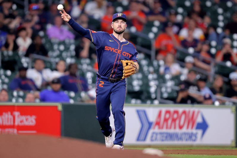 May 20, 2024; Houston, Texas, USA; Houston Astros third baseman Alex Bregman (2) throws a fielded ball to first base for an out against the Los Angeles Angels during the seventh inning at Minute Maid Park. Mandatory Credit: Erik Williams-USA TODAY Sports