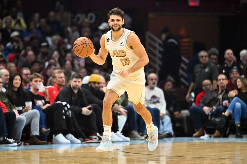 CLEVELAND, OHIO - JANUARY 04: Raul Neto #19 of the Cleveland Cavaliers brings the ball up court during the first half against the Phoenix Suns at Rocket Mortgage Fieldhouse on January 04, 2023 in Cleveland, Ohio. NOTE TO USER: User expressly acknowledges and agrees that, by downloading and or using this photograph, User is consenting to the terms and conditions of the Getty Images License Agreement. (Photo by Jason Miller/Getty Images)