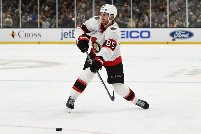 Nov 9, 2024; Boston, Massachusetts, USA; Ottawa Senators defenseman Jake Sanderson (85) takes a shot against the Boston Bruins during the second period at TD Garden. Mandatory Credit: Brian Fluharty-Imagn Images