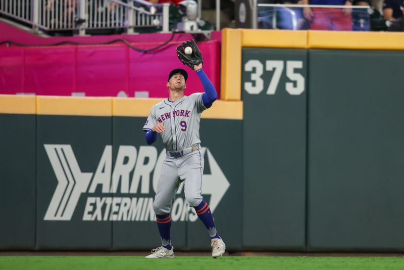 Sep 24, 2024; Atlanta, Georgia, USA; New York Mets left fielder Brandon Nimmo (9) catches a fly ball against the Atlanta Braves in the seventh inning at Truist Park. Mandatory Credit: Brett Davis-Imagn Images