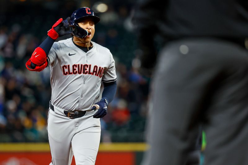 Apr 2, 2024; Seattle, Washington, USA; Cleveland Guardians designated hitter Bo Naylor (23) celebrates while running the bases after hitting a two-run home run against the Seattle Mariners during the fourth inning at T-Mobile Park. Mandatory Credit: Joe Nicholson-USA TODAY Sports