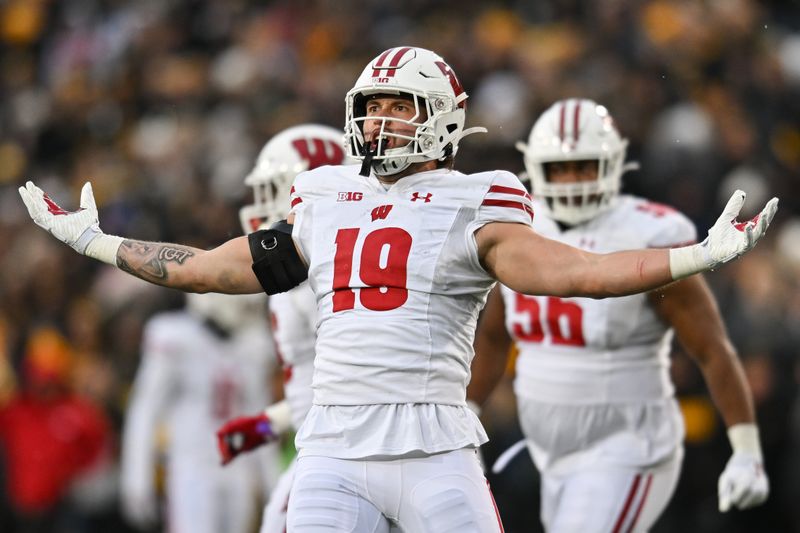 Nov 12, 2022; Iowa City, Iowa, USA; Wisconsin Badgers linebacker Nick Herbig (19) reacts after a sack against the Iowa Hawkeyes during the second quarter at Kinnick Stadium. Mandatory Credit: Jeffrey Becker-USA TODAY Sports