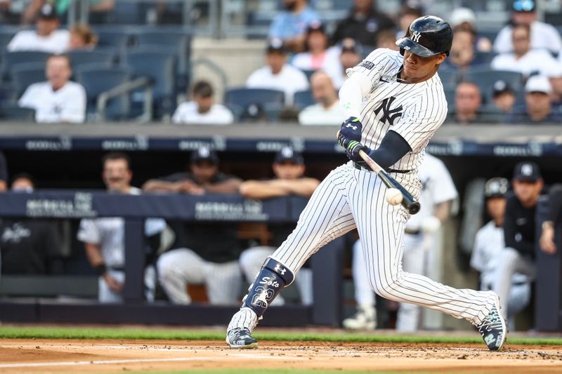 Jul 19, 2024; Bronx, New York, USA;  New York Yankees right fielder Juan Soto (22) hits a single in the first inning against the Tampa Bay Rays at Yankee Stadium. Mandatory Credit: Wendell Cruz-USA TODAY Sports