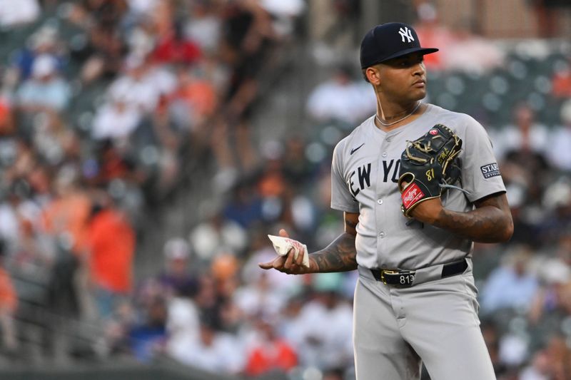 May 1, 2024; Baltimore, Maryland, USA;  New York Yankees pitcher Luis Gil (81) holds a rosin bag before the start of the bottom of the third inning against the Baltimore Orioles at Oriole Park at Camden Yards. Mandatory Credit: Tommy Gilligan-USA TODAY Sports