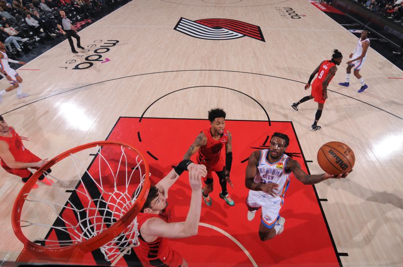 PORTLAND, OR - JANUARY 26: Cason Wallace #22 of the Oklahoma City Thunder drives to the basket during the game against the Portland Trail Blazers on January 26, 2025 at the Moda Center Arena in Portland, Oregon. NOTE TO USER: User expressly acknowledges and agrees that, by downloading and or using this photograph, user is consenting to the terms and conditions of the Getty Images License Agreement. Mandatory Copyright Notice: Copyright 2025 NBAE (Photo by Cameron Browne/NBAE via Getty Images)