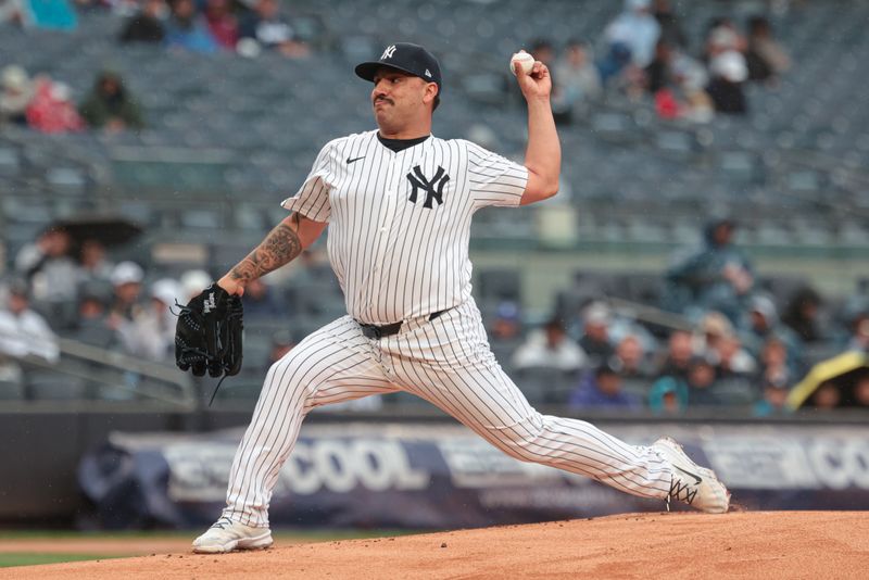 May 5, 2024; Bronx, New York, USA; New York Yankees starting pitcher Nestor Cortes (65) delivers a pitch during the first inning against the Detroit Tigers at Yankee Stadium. Mandatory Credit: Vincent Carchietta-USA TODAY Sports