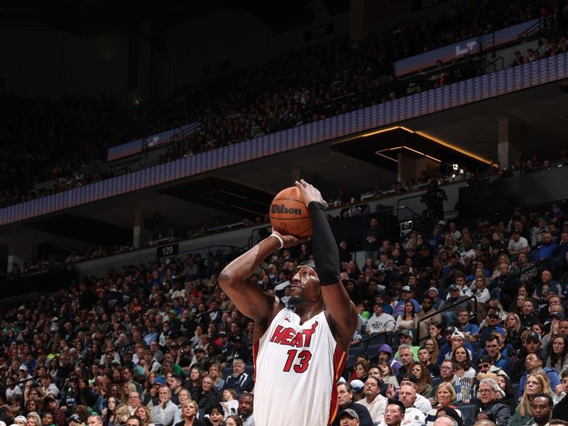 MINNEAPOLIS, MN -  NOVEMBER 10: Bam Adebayo #13 of the Miami Heat shoots a three point basket during the game against the Minnesota Timberwolves on November 10, 2024 at Target Center in Minneapolis, Minnesota. NOTE TO USER: User expressly acknowledges and agrees that, by downloading and or using this Photograph, user is consenting to the terms and conditions of the Getty Images License Agreement. Mandatory Copyright Notice: Copyright 2024 NBAE (Photo by David Sherman/NBAE via Getty Images)