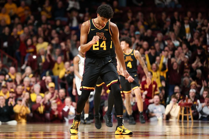 Feb 6, 2024; Minneapolis, Minnesota, USA; Minnesota Golden Gophers guard Cam Christie (24) celebrates after drawing a foul on his three-point shot against the Michigan State Spartans during the second half at Williams Arena. Mandatory Credit: Matt Krohn-USA TODAY Sports