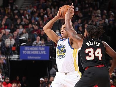 PORTLAND, OR - DECEMBER 17:  Trayce Jackson-Davis #32 of the Golden State Warriors  handles the ball during the game  on December 17, 2023 at the Moda Center Arena in Portland, Oregon. NOTE TO USER: User expressly acknowledges and agrees that, by downloading and or using this photograph, user is consenting to the terms and conditions of the Getty Images License Agreement. Mandatory Copyright Notice: Copyright 2023 NBAE (Photo by David Sherman/NBAE via Getty Images)