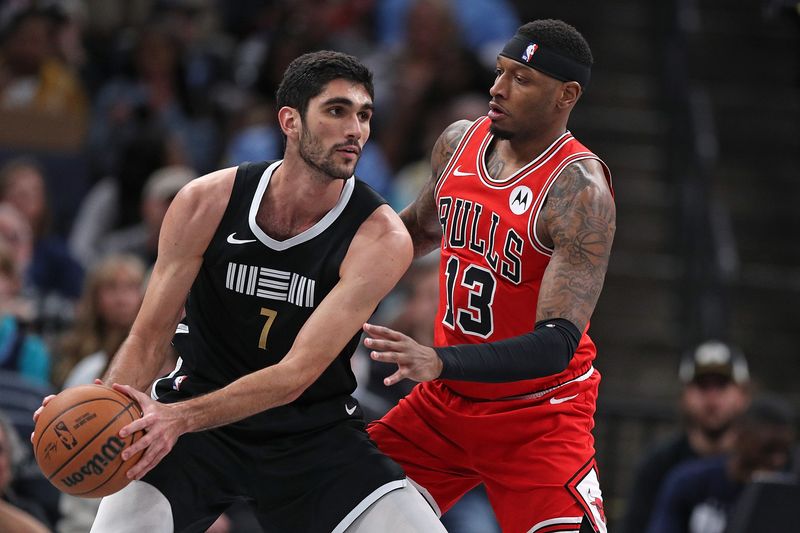 MEMPHIS, TENNESSEE - FEBRUARY 08: Santi Aldama #7 of the Memphis Grizzlies handles the ball against Torrey Craig #13 of the Chicago Bulls during the first half at FedExForum on February 08, 2024 in Memphis, Tennessee. NOTE TO USER: User expressly acknowledges and agrees that, by downloading and or using this photograph, User is consenting to the terms and conditions of the Getty Images License Agreement. (Photo by Justin Ford/Getty Images)