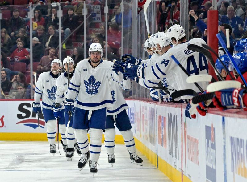 Apr 6, 2024; Montreal, Quebec, CAN; Toronto Maple Leafs forward Auston Matthews (34) celebrates with teammates after scoring a goal against the Montreal Canadiens during the second period at the Bell Centre. Mandatory Credit: Eric Bolte-USA TODAY Sports