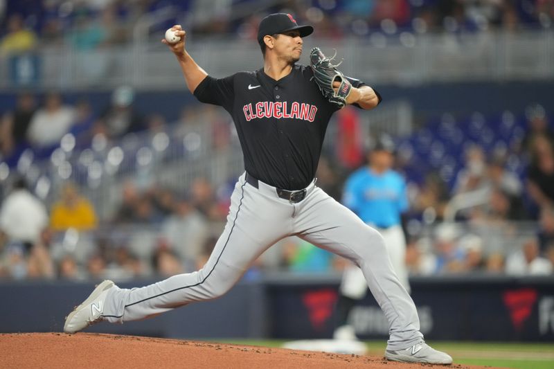Jun 9, 2024; Miami, Florida, USA; Cleveland Guardians starting pitcher Carlos Carrasco (59) pitches against the Miami Marlins in the first inning at loanDepot Park. Mandatory Credit: Jim Rassol-USA TODAY Sports