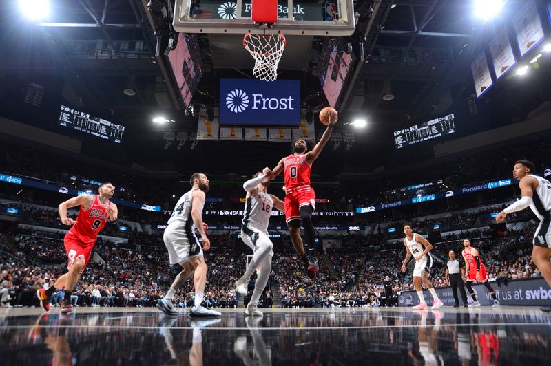 SAN ANTONIO, TX - JANUARY 13: Coby White #0 of the Chicago Bulls drives to the basket during the game against the San Antonio Spurs on January 13, 2024 at the Frost Bank Center in San Antonio, Texas. NOTE TO USER: User expressly acknowledges and agrees that, by downloading and or using this photograph, user is consenting to the terms and conditions of the Getty Images License Agreement. Mandatory Copyright Notice: Copyright 2024 NBAE (Photos by Michael Gonzales/NBAE via Getty Images)