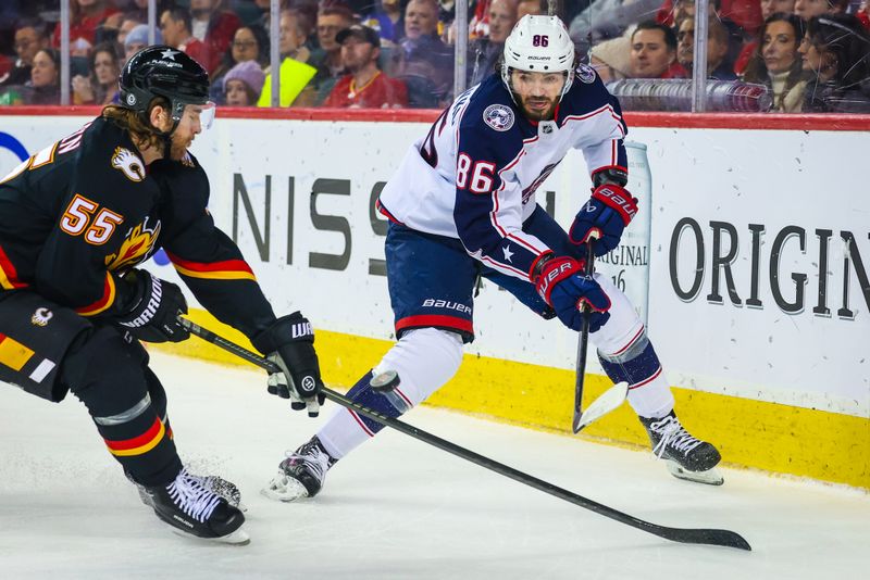 Jan 25, 2024; Calgary, Alberta, CAN; Columbus Blue Jackets right wing Kirill Marchenko (86) passes the puck against the Calgary Flames during the second period at Scotiabank Saddledome. Mandatory Credit: Sergei Belski-USA TODAY Sports