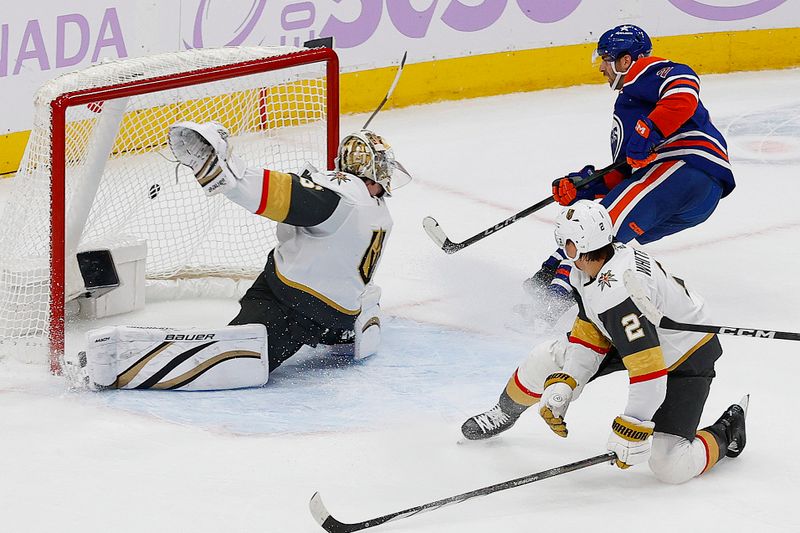 Nov 28, 2023; Edmonton, Alberta, CAN; Vegas Golden Knights goaltender Logan Thompson (36) mas on Edmonton Oilers defensemen Evan Bouchard (2) during overtime at Rogers Place. Mandatory Credit: Perry Nelson-USA TODAY Sports