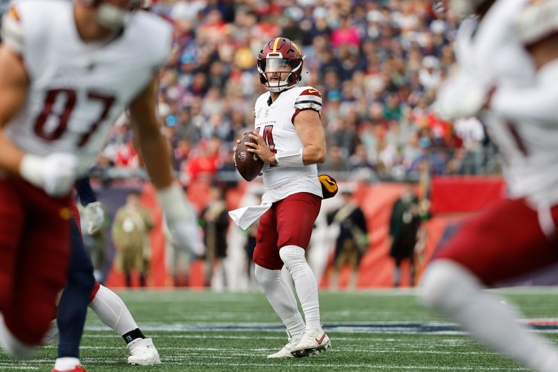 Washington Commanders quarterback Sam Howell drops back to pass against the New England Patriots during an NFL football game at Gillette Stadium, Sunday Nov. 5, 2023 in Foxborough, Mass. (Winslow Townson/AP Images for Panini)