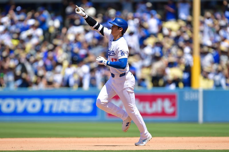 Jun 16, 2024; Los Angeles, California, USA; Los Angeles Dodgers designated hitter Shohei Ohtani (17) reacts after hitting a solo home run against the Kansas City Royals during the sixth inning at Dodger Stadium. Mandatory Credit: Gary A. Vasquez-USA TODAY Sports