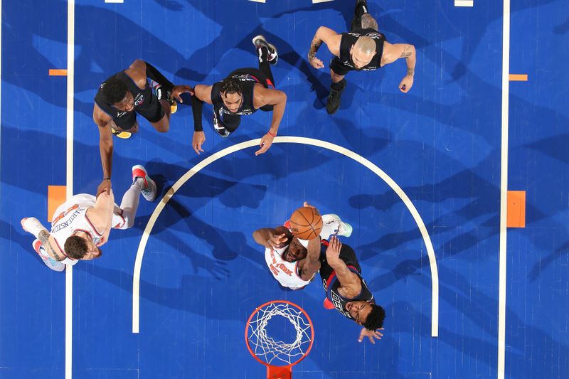 NEW YORK, NY - MARCH 25:  Precious Achiuwa #5 of the New York Knicks drives to the basket during the game against as Jared Rhoden #8 of the Detroit Pistons plays defense on March 25, 2024 at Madison Square Garden in New York City, New York.  NOTE TO USER: User expressly acknowledges and agrees that, by downloading and or using this photograph, User is consenting to the terms and conditions of the Getty Images License Agreement. Mandatory Copyright Notice: Copyright 2024 NBAE  (Photo by David L. Nemec /NBAE via Getty Images)