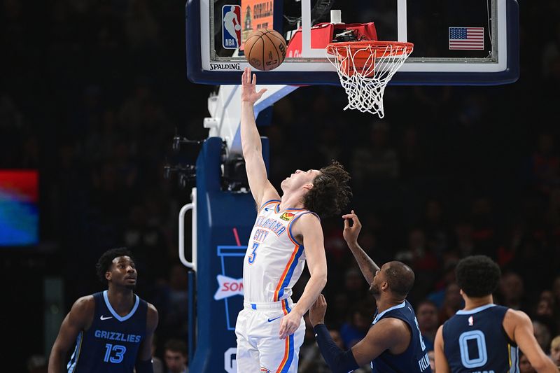 OKLAHOMA CITY, OKLAHOMA - DECEMBER 18: Josh Giddey #3 of the Oklahoma City Thunder lays the ball in at the rim during the first half against the Memphis Grizzlies at Paycom Center on December 18, 2023 in Oklahoma City, Oklahoma. NOTE TO USER: User expressly acknowledges and agrees that, by downloading and or using this Photograph, user is consenting to the terms and conditions of the Getty Images License Agreement. (Photo by Joshua Gateley/Getty Images)