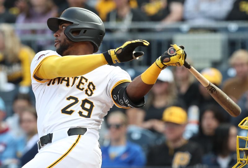 May 24, 2025; Pittsburgh, Pennsylvania, USA;  Pittsburgh Pirates left fielder Alexander Canario (29) hits a single against the Milwaukee Brewers during the fourth inning at PNC Park. Mandatory Credit: Charles LeClaire-Imagn Images
