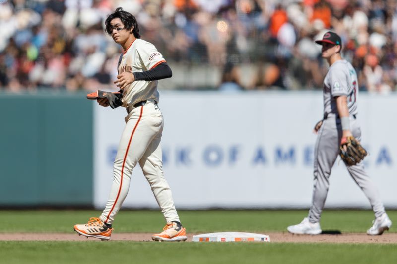 Apr 21, 2024; San Francisco, California, USA;  San Francisco Giants center fielder Jung Hoo Lee (51) reacts after being picked off on a failed steal attempt against the Arizona Diamondbacks during the eighth inning at Oracle Park. Mandatory Credit: John Hefti-USA TODAY Sports