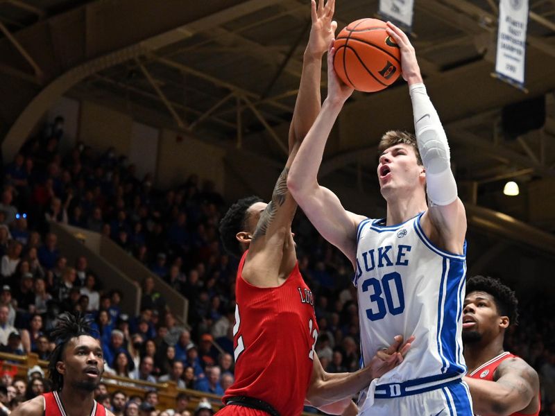 Feb 20, 2023; Durham, North Carolina, USA; Duke Blue Devils center Kyle Filipowski (30) shoots over Louisville Cardinals forward JJ Traynor (12) during the second half at Cameron Indoor Stadium. The Blue Devils won 79-62. Mandatory Credit: Rob Kinnan-USA TODAY Sports