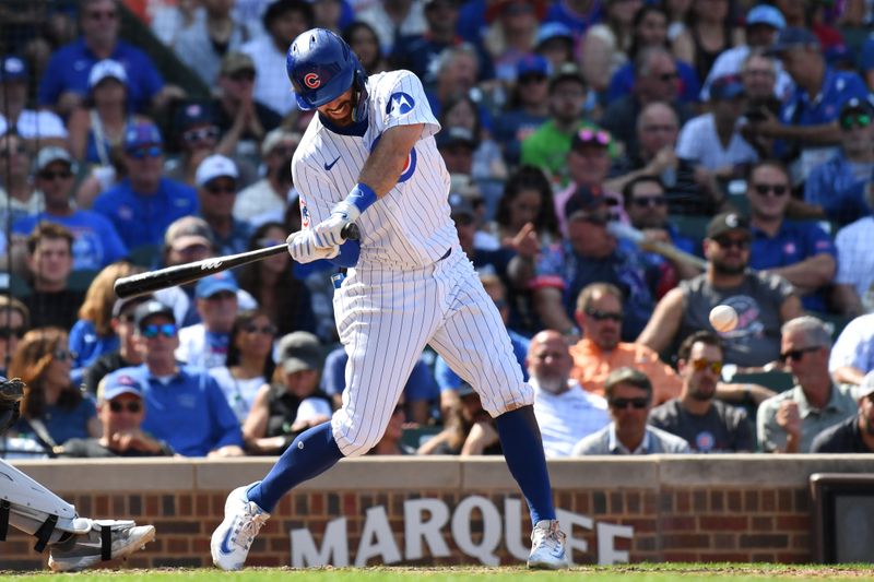Aug 22, 2024; Chicago, Illinois, USA; Chicago Cubs shortstop Dansby Swanson (7) hits an RBI single during the seventh inning against the Detroit Tigers at Wrigley Field. Mandatory Credit: Patrick Gorski-USA TODAY Sports