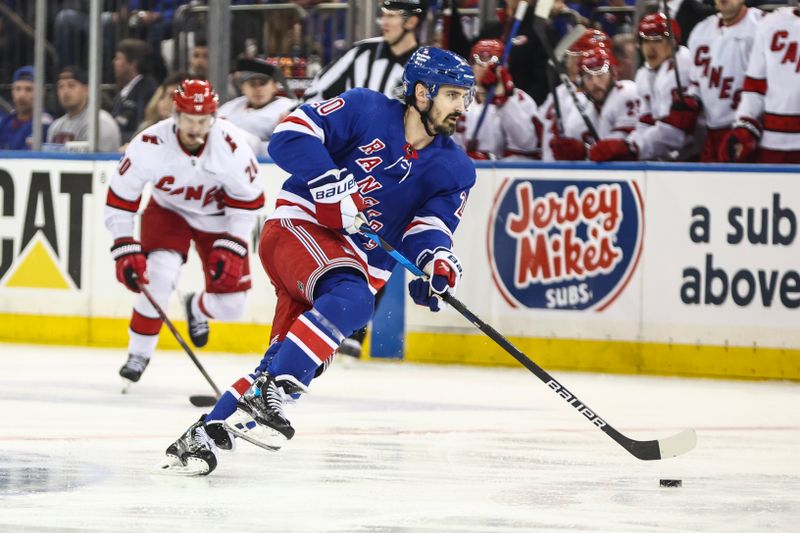 May 5, 2024; New York, New York, USA; New York Rangers left wing Chris Kreider (20) controls the puck in the second period against the Carolina Hurricanes in game one of the second round of the 2024 Stanley Cup Playoffs at Madison Square Garden. Mandatory Credit: Wendell Cruz-USA TODAY Sports