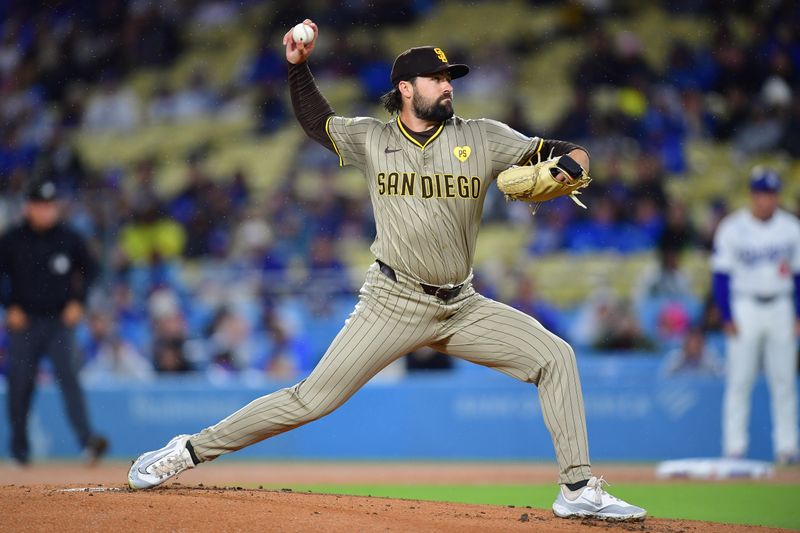 Apr 13, 2024; Los Angeles, California, USA; San Diego Padres starting pitcher Matt Waldron (61) throws against the Los Angeles Dodgers during the first inning at Dodger Stadium. Mandatory Credit: Gary A. Vasquez-USA TODAY Sports