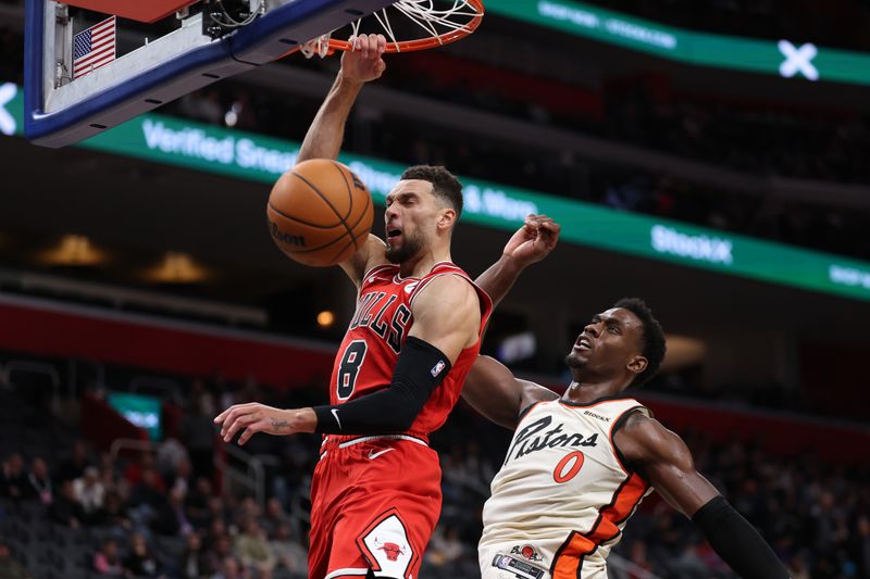 DETROIT, MICHIGAN - NOVEMBER 18: Zach LaVine #8 of the Chicago Bulls drives to the basket past Jalen Duren #0 of the Detroit Pistons during the second half at Little Caesars Arena on November 18, 2024 in Detroit, Michigan. Chicago won the game 122-112. NOTE TO USER: User expressly acknowledges and agrees that, by downloading and or using this photograph, User is consenting to the terms and conditions of the Getty Images License. (Photo by Gregory Shamus/Getty Images)