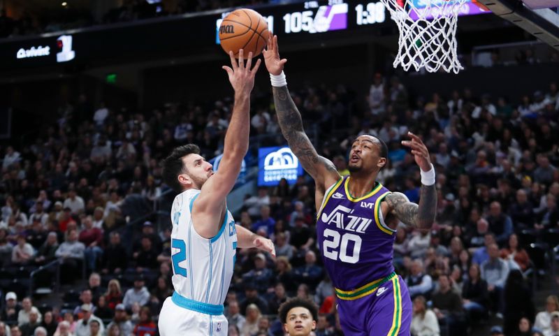 SALT LAKE CITY, UT - FEBRUARY 22: John Collins #20 of the Utah Jazz blocks a shot by Vasa Micic #22 of the Charlotte Hornets during the second half of their game at the Delta Center on February 22, 2024 in Salt Lake City, Utah.  NOTE TO USER: User expressly acknowledges and agrees that, by downloading and or using this Photograph, User is concenting to the terms and conditions of the Getty Images license Agreement. (Photo by Chris Gardner/Getty Images)