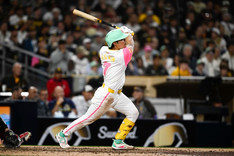 Jun 7, 2024; San Diego, California, USA; San Diego Padres shortstop Ha-Seong Kim (7) hits a two-run home run during the sixth inning against the Arizona Diamondbacks at Petco Park. Mandatory Credit: Denis Poroy-USA TODAY Sports at Petco Park. 