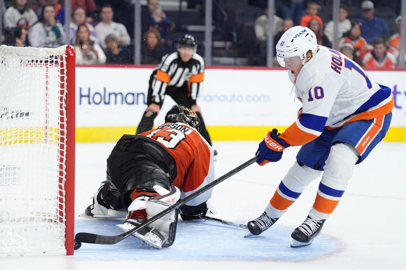 Oct 25, 2025; Philadelphia, Pennsylvania, USA; Philadelphia Flyers goalie Samuel Ersson (33) allows a shootout goal to New York Islanders right wing Simon Holmstrom (10) in overtime at Xfinity Mobile Arena. Mandatory Credit: Kyle Ross-Imagn Images