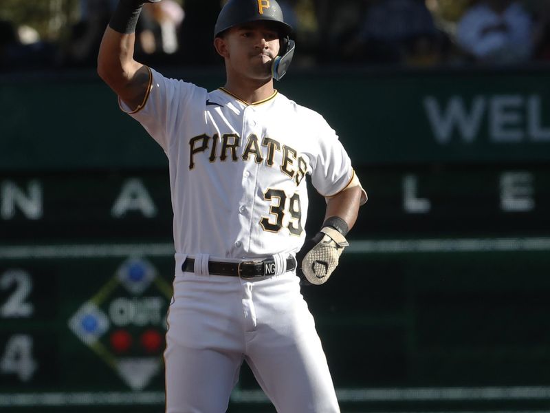 Oct 1, 2023; Pittsburgh, Pennsylvania, USA;  Pittsburgh Pirates second baseman Nick Gonzales (39) reacts at second base with a double against the Miami Marlins during the seventh inning at PNC Park. Pittsburgh won 3-0. Mandatory Credit: Charles LeClaire-USA TODAY Sports