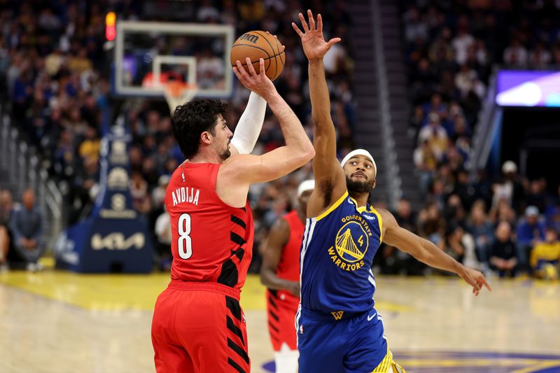 SAN FRANCISCO, CALIFORNIA - MARCH 10: Deni Avdija #8 of the Portland Trail Blazers shoots over Moses Moody #4 of the Golden State Warriors during the second half at Chase Center on March 10, 2025 in San Francisco, California. NOTE TO USER: User expressly acknowledges and agrees that, by downloading and/or using this photograph, user is consenting to the terms and conditions of the Getty Images License Agreement.   (Photo by Ezra Shaw/Getty Images)