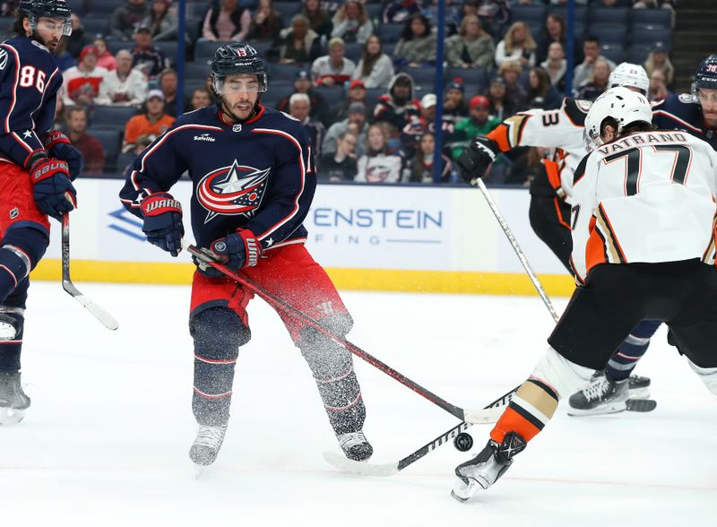 Oct 24, 2023; Columbus, Ohio, USA; Columbus Blue Jackets left wing Johnny Gaudreau (13) loses the puck  to Anaheim Ducks right wing Frank Vatrano (77)during the second period at Nationwide Arena. Mandatory Credit: Joseph Maiorana-USA TODAY Sports