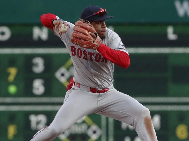 Apr 20, 2024; Pittsburgh, Pennsylvania, USA;  Boston Red Sox second baseman Enmanuel Valdez (47) throws to first base to complete a double play against the Pittsburgh Pirates during the seventh inning at PNC Park. Boston won 4-2.Mandatory Credit: Charles LeClaire-USA TODAY Sports