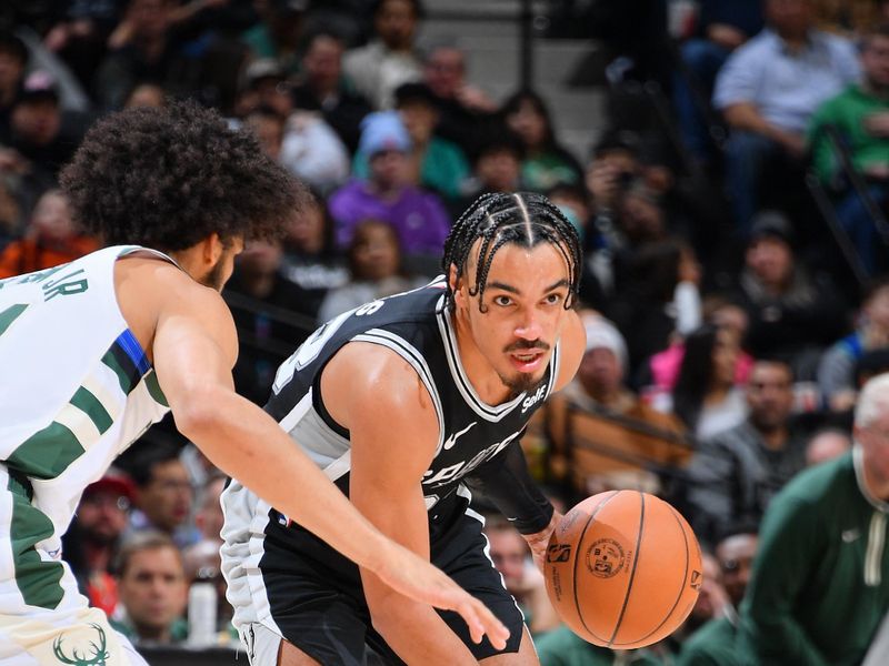 SAN ANTONIO, TX - JANUARY 4: Tre Jones #33 of the San Antonio Spurs dribbles the ball during the game against the Milwaukee Bucks on January 4, 2024 at the Frost Bank Center in San Antonio, Texas. NOTE TO USER: User expressly acknowledges and agrees that, by downloading and or using this photograph, user is consenting to the terms and conditions of the Getty Images License Agreement. Mandatory Copyright Notice: Copyright 2024 NBAE (Photos by Michael Gonzales/NBAE via Getty Images)