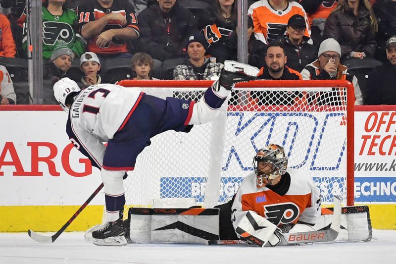 Jan 4, 2024; Philadelphia, Pennsylvania, USA; Columbus Blue Jackets left wing Johnny Gaudreau (13) scores a goal against Philadelphia Flyers goaltender Samuel Ersson (33) during the shootout at Wells Fargo Center. Mandatory Credit: Eric Hartline-USA TODAY Sports