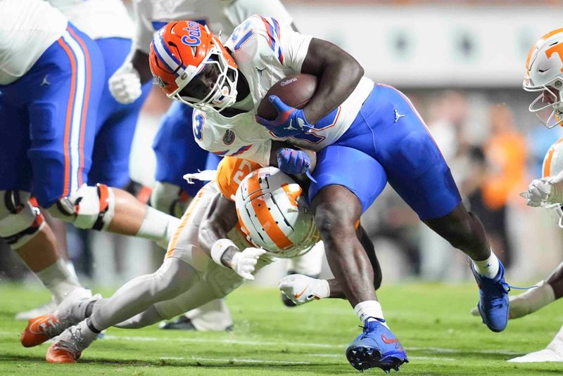 Oct 12, 2024; Knoxville, Tennessee, USA; Florida Gators running back Jadan Baugh (13) is tackled during a game against the Tennessee Volunteerss at Neyland Stadium. Mandatory Credit: Brianna Paciorka/USA TODAY Network via Imagn Images