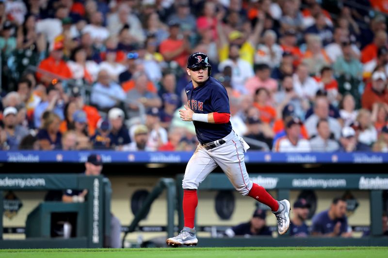 Aug 24, 2023; Houston, Texas, USA; Boston Red Sox second baseman Luis Urias (17) runs towards home plate to score a run against the Houston Astros during the third inning at Minute Maid Park. Mandatory Credit: Erik Williams-USA TODAY Sports
