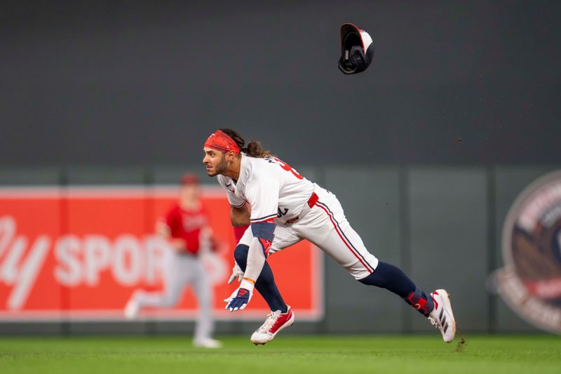 Sep 9, 2024; Minneapolis, Minnesota, USA; Minnesota Twins left fielder Austin Martin (82) slides into second base for a double during the fourth inning against the Los Angeles Angels at Target Field. Mandatory Credit: Jesse Johnson-Imagn Images